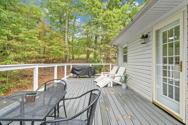 a view of balcony with deck and furniture