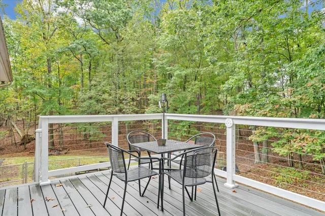 a view of a house with a yard and sitting area