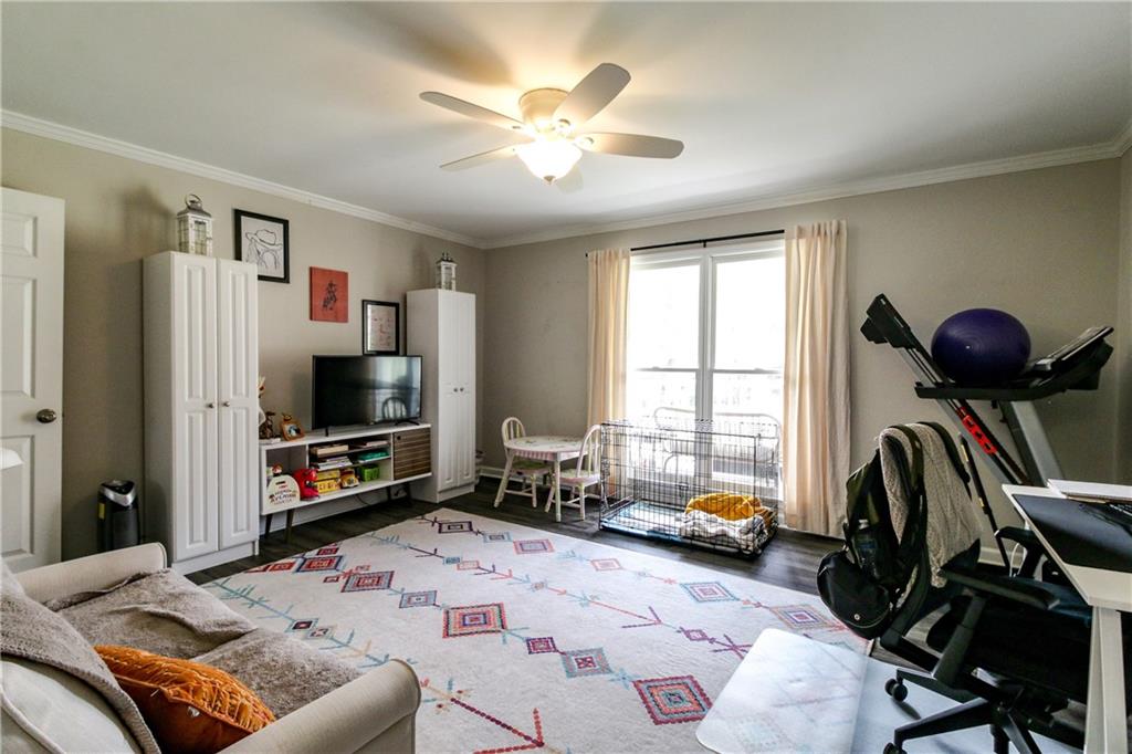 1155 Orchid Way Canton, GA 30115 - Photo 13 of 40 a bedroom with furniture and a flat screen tv