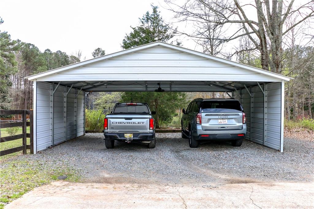 1155 Orchid Way Canton, GA 30115 - Photo 30 of 40 a view of garage with a car parked in it
