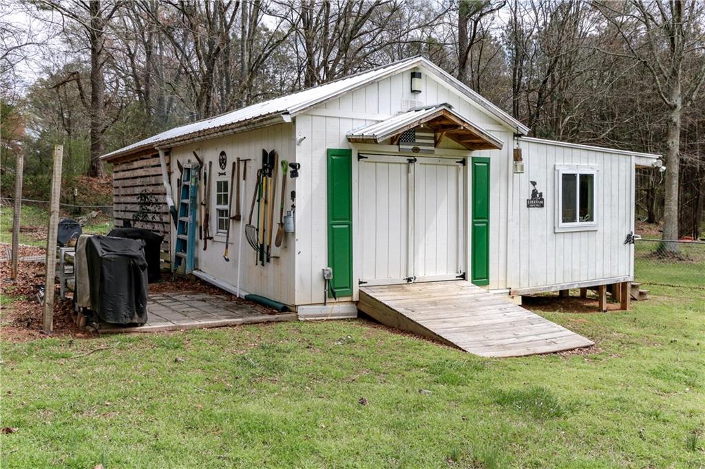 1155 Orchid Way Canton, GA 30115 - Photo 34 of 40 a front view of a house with garden