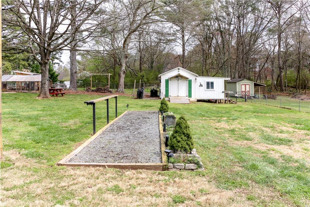 1155 Orchid Way Canton, GA 30115 - Photo 35 of 40 a front view of a house with garden