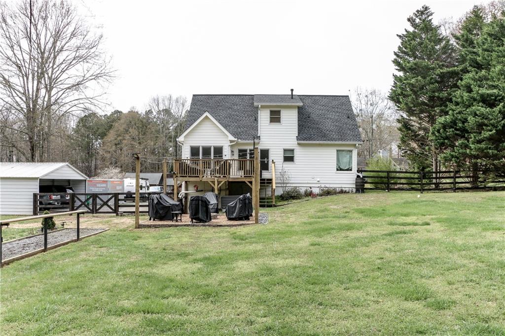 1155 Orchid Way Canton, GA 30115 - Photo 38 of 40 a view of a house with backyard and sitting area