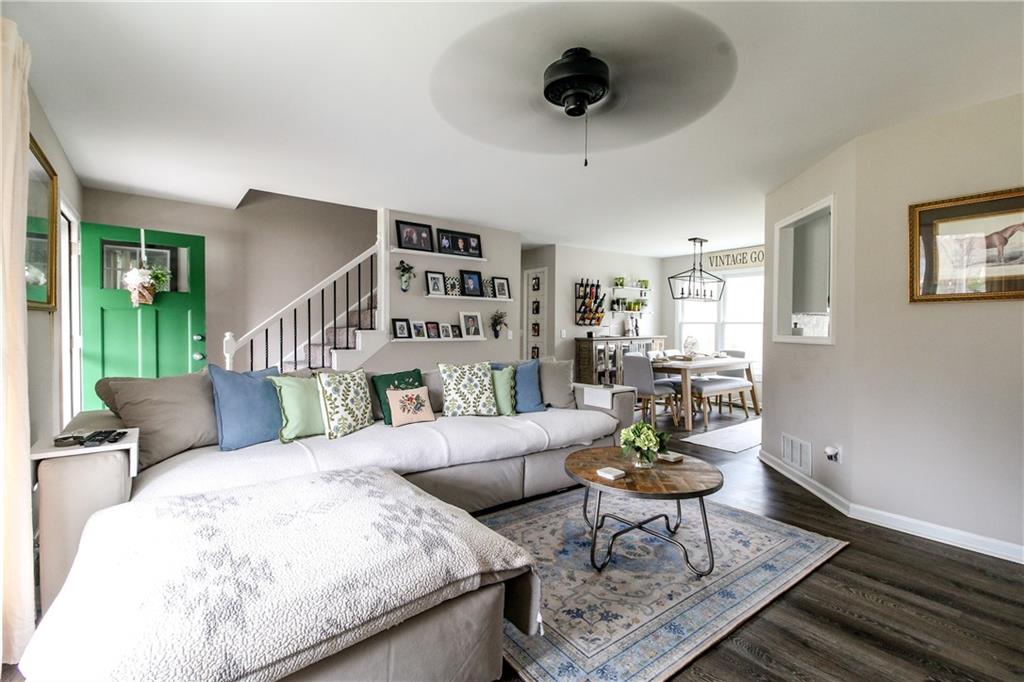 1155 Orchid Way Canton, GA 30115 - Photo 5 of 40 a living room with furniture and a wooden floor