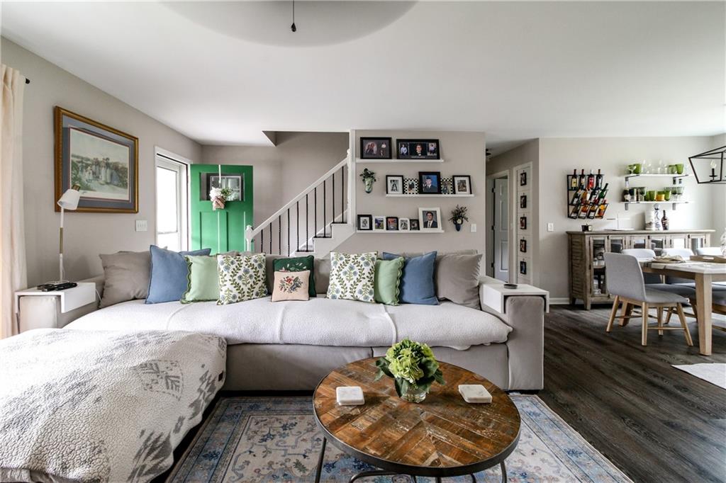 1155 Orchid Way Canton, GA 30115 - Photo 6 of 40 a living room with furniture and a book shelf