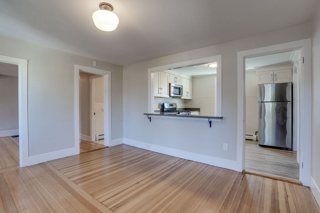 31 High Street, Unit 2 Beverly, MA 01915 - Photo 11 of 27 a view of a kitchen from the hallway