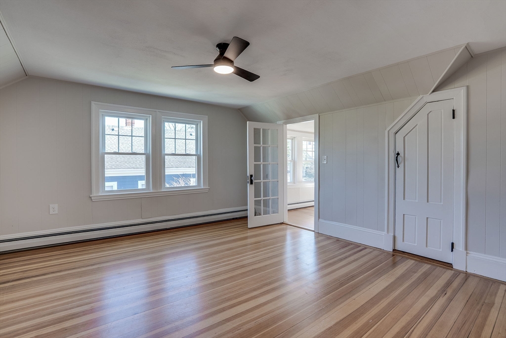 31 High Street, Unit 2 Beverly, MA 01915 - Photo 13 of 27 a view of an empty room with wooden floor and a window