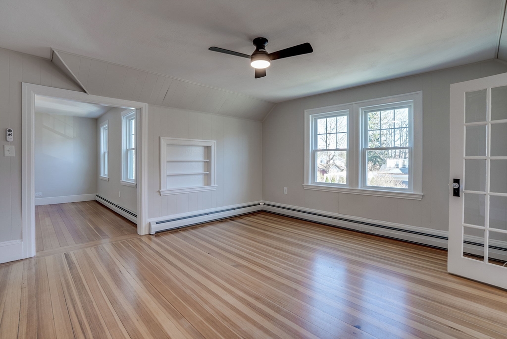 31 High Street, Unit 2 Beverly, MA 01915 - Photo 14 of 27 wooden floor in an empty room with a window