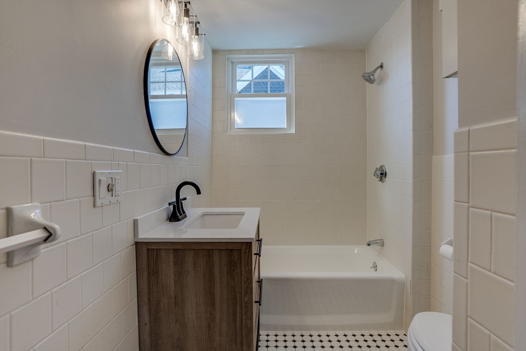 31 High Street, Unit 2 Beverly, MA 01915 - Photo 17 of 27 a bathroom with a sink toilet and shower