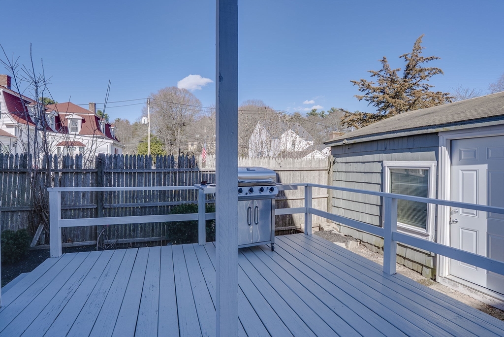 31 High Street, Unit 2 Beverly, MA 01915 - Photo 25 of 27 a view of a balcony with wooden floor and a potted plant