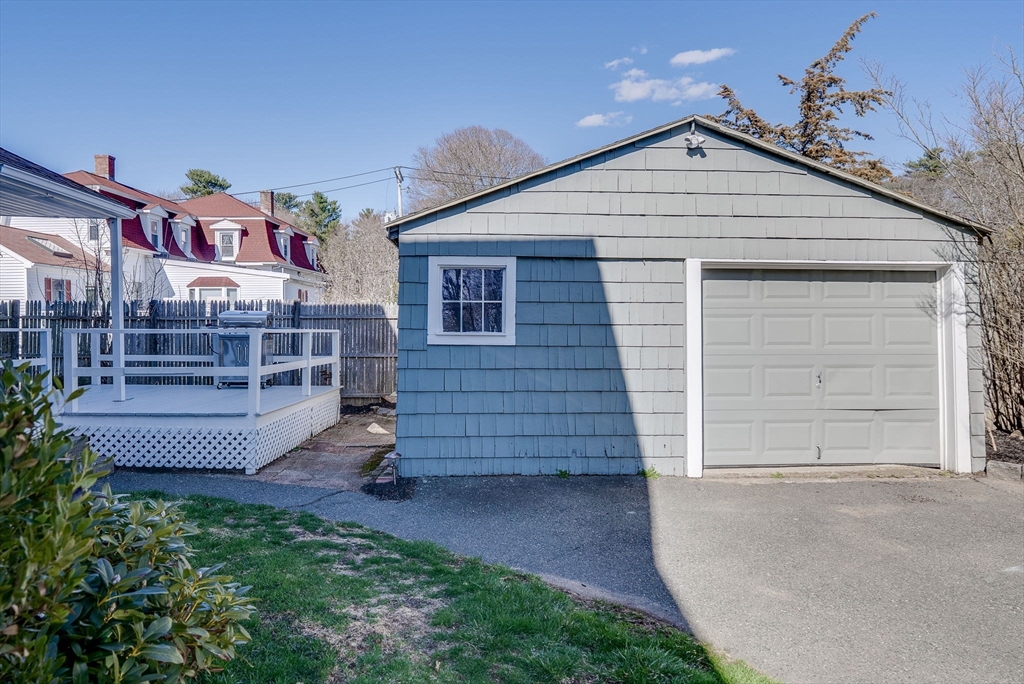 31 High Street, Unit 2 Beverly, MA 01915 - Photo 26 of 27 front view of a house with a bench