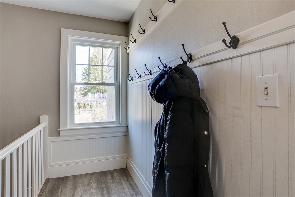 31 High Street, Unit 2 Beverly, MA 01915 - Photo 3 of 27 a view of walk in closet with clothes and shoes