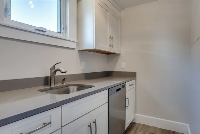 a kitchen with a sink and cabinets