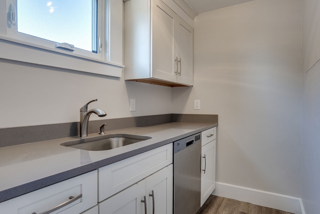 31 High Street, Unit 2 Beverly, MA 01915 - Photo 5 of 27 a kitchen with a sink and cabinets