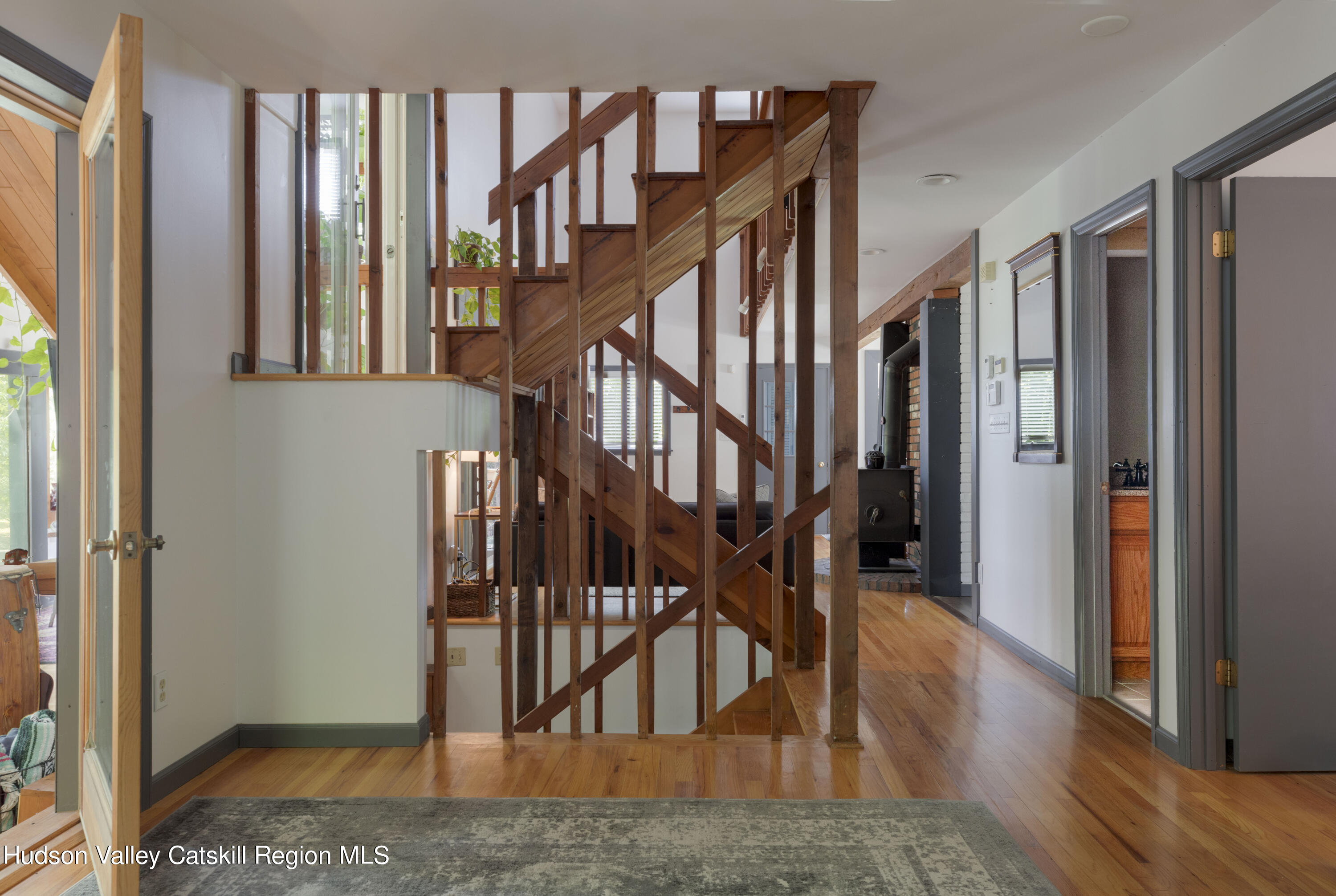 501 Huckleberry Turnpike Wallkill, NY 12589 - Photo 15 of 36 a view of staircase with lots of frames on wall and wooden floors