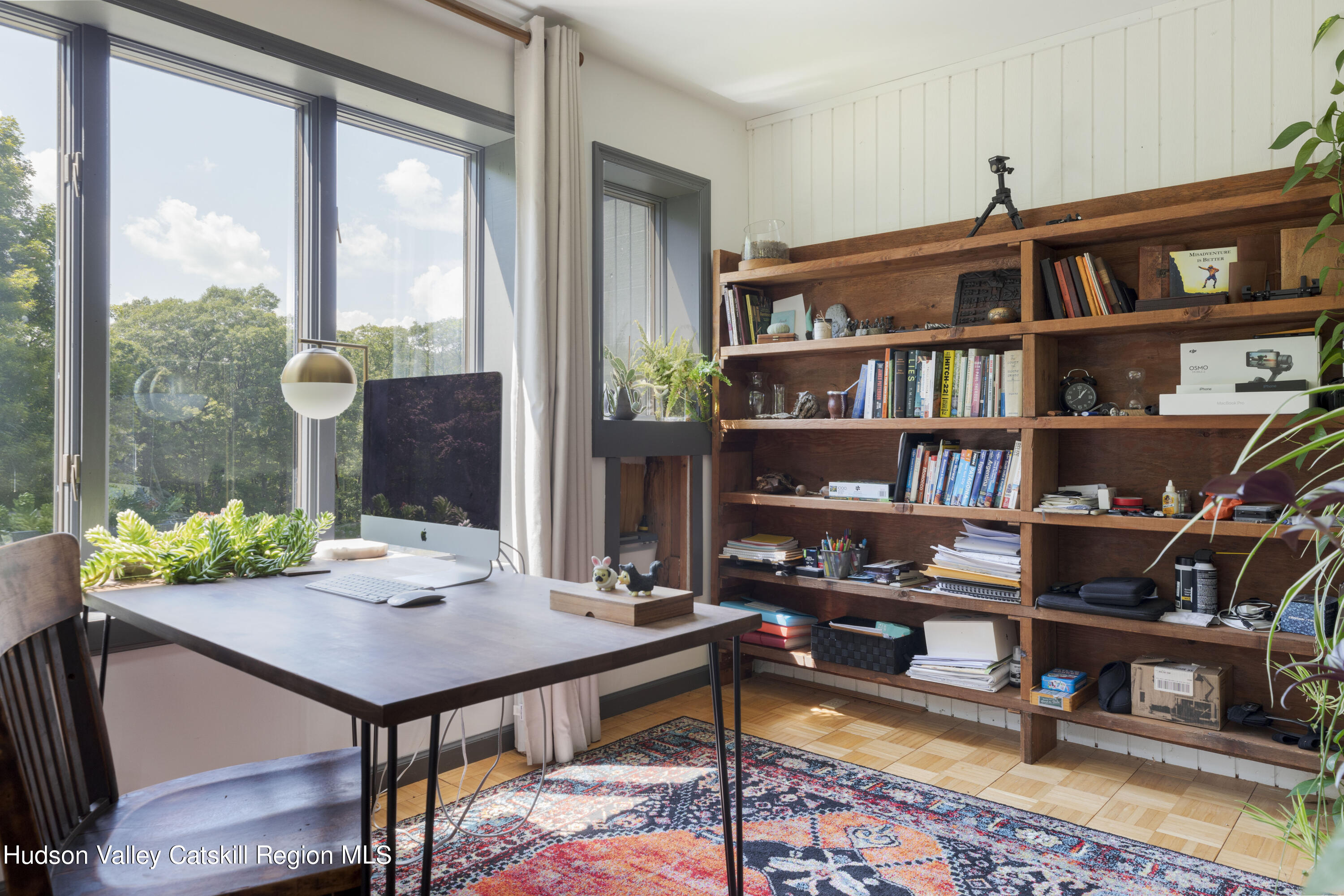 501 Huckleberry Turnpike Wallkill, NY 12589 - Photo 21 of 36 a view of a workspace with furniture and a book shelf