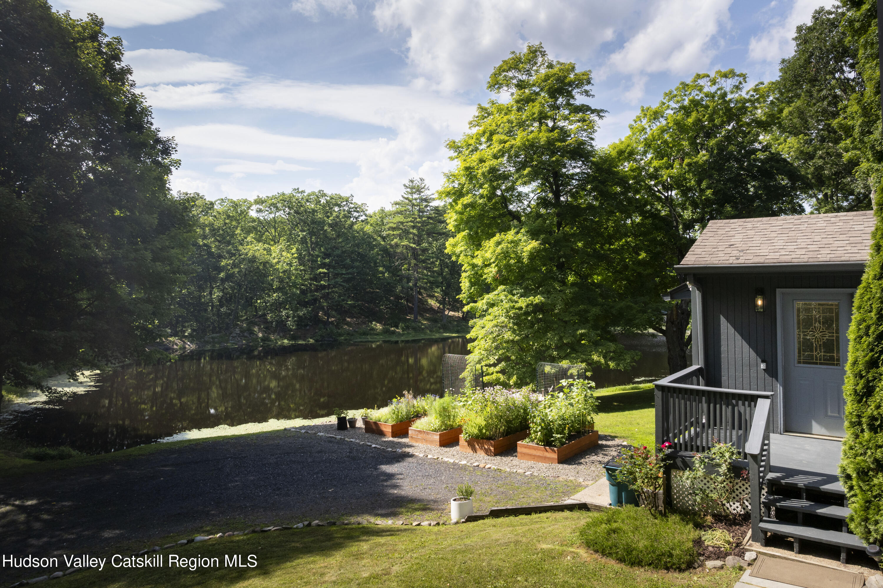 501 Huckleberry Turnpike Wallkill, NY 12589 - Photo 3 of 36 a view of a patio with table and chairs potted plants and large tree