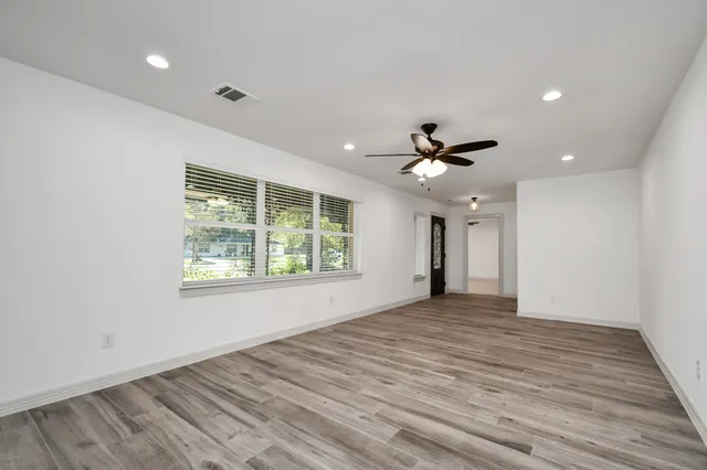 a view of an empty room with a window
