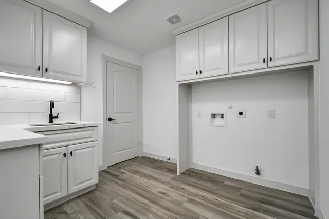 a view of cabinets and wooden floor