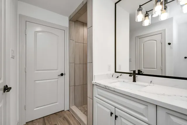 a bathroom with a sink and a mirror