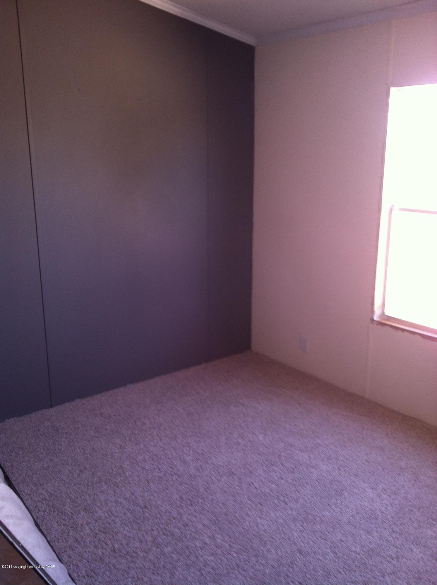 14176 Savannah Road Amarillo, TX 79118 - Photo 14 of 17 an empty room with a window