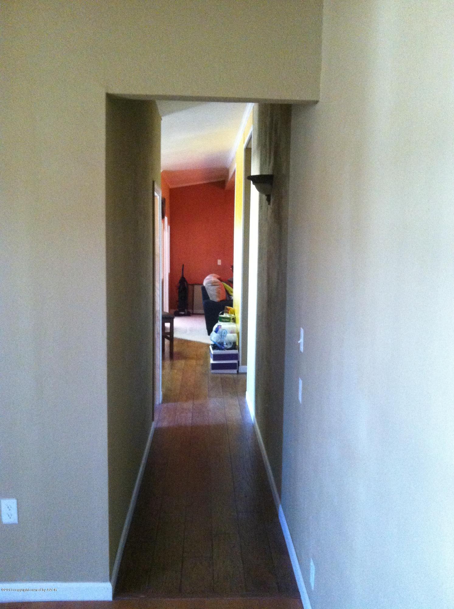 14176 Savannah Road Amarillo, TX 79118 - Photo 15 of 17 a view of a hallway with a livingroom and furniture