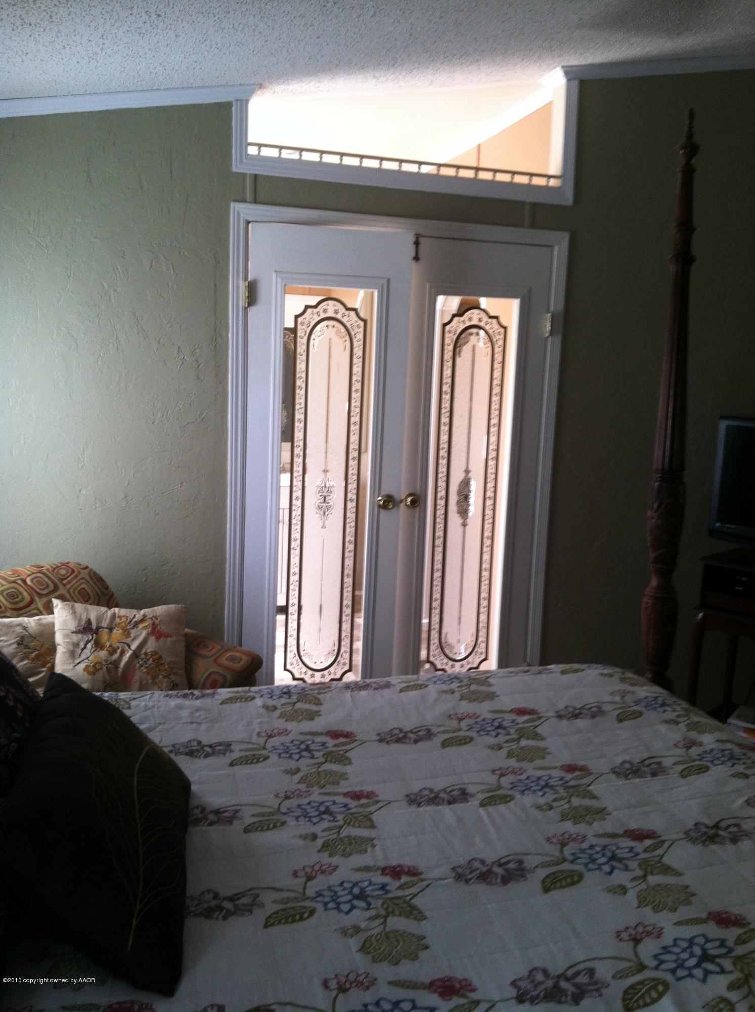 14176 Savannah Road Amarillo, TX 79118 - Photo 10 of 17 a bedroom with a bed and a window