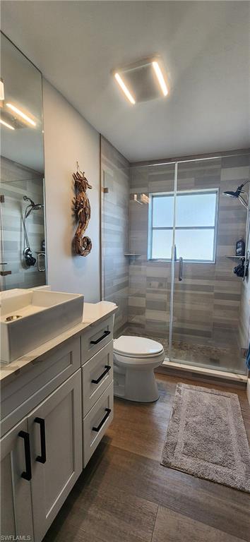 1280 Morningside Drive Naples, FL 34103 - Photo 14 of 35 a bathroom with a sink a toilet and shower