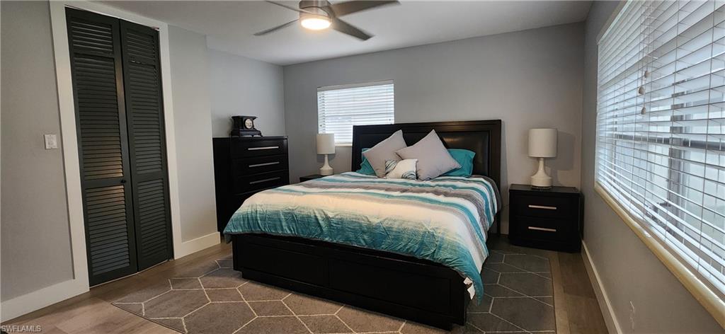 1280 Morningside Drive Naples, FL 34103 - Photo 18 of 35 a bed room with a bed and a night stand