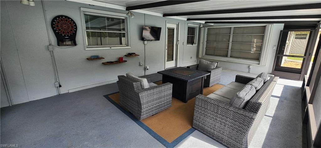 1280 Morningside Drive Naples, FL 34103 - Photo 25 of 35 a living room with furniture and window