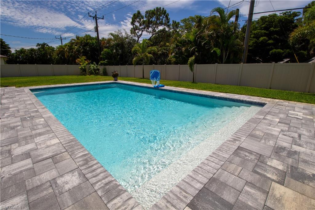 1280 Morningside Drive Naples, FL 34103 - Photo 28 of 35 a view of swimming pool with a yard
