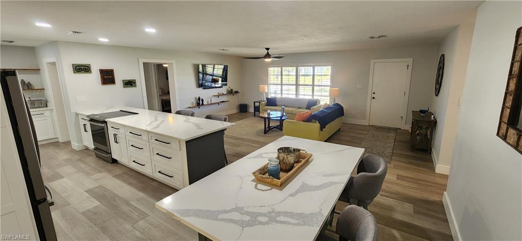 1280 Morningside Drive Naples, FL 34103 - Photo 3 of 35 a living room with furniture and a window