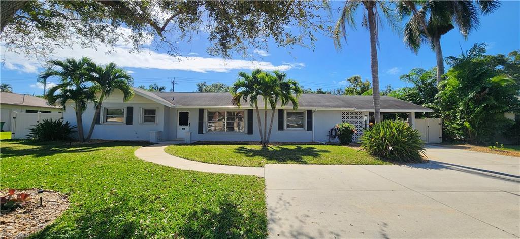1280 Morningside Drive Naples, FL 34103 - Photo 32 of 35 a front view of a house with garden