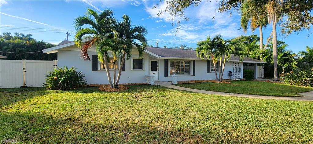 1280 Morningside Drive Naples, FL 34103 - Photo 33 of 35 a front view of a house with garden