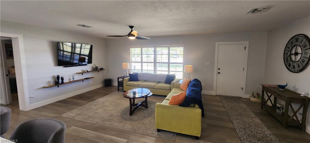 1280 Morningside Drive Naples, FL 34103 - Photo 4 of 35 a living room with furniture and a flat screen tv