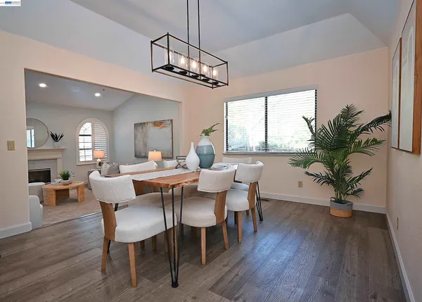 a dining room with furniture and window