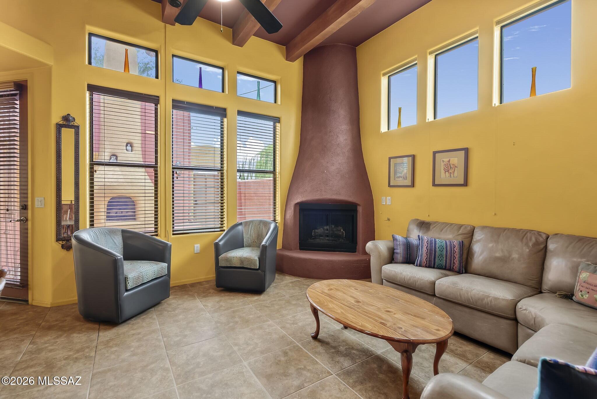 101 Post Way Tubac, AZ 85646 - Photo 6 of 31 a living room with furniture ceiling fan and a window