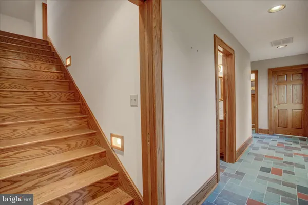 a view of a livingroom with furniture and a ceiling fan