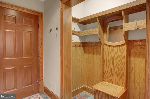 a view of a refrigerator in kitchen and wooden floor