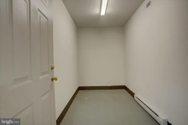 a view of a hallway with entryway door