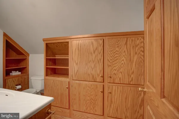 a view of a hallway with paintings on the wall