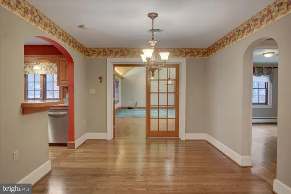 a kitchen with stainless steel appliances granite countertop a refrigerator and a stove