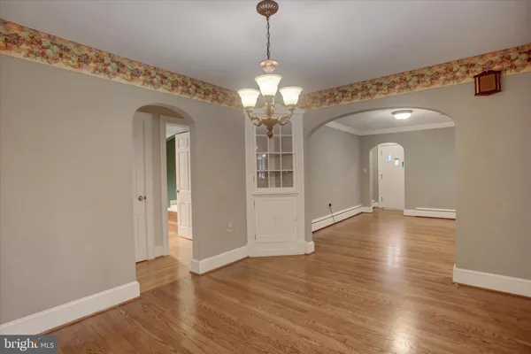 a bed sitting in a room next to a large window