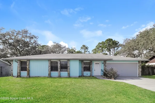 front view of a house with a yard
