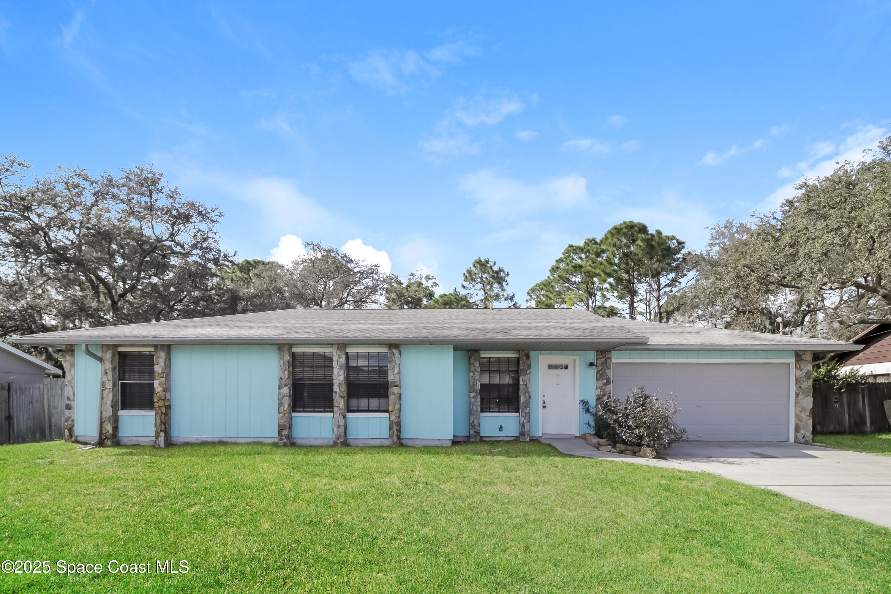 front view of a house with a yard