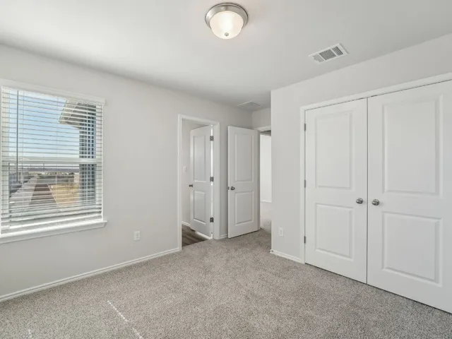 a bathroom with a shower sink and mirror