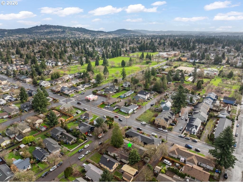 6421 Southeast 58th Avenue Portland, OR 97206 - Photo 13 of 14 an aerial view of residential houses with outdoor space and trees