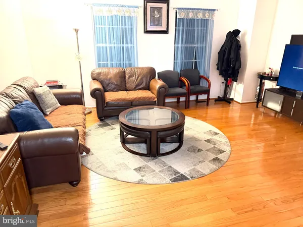 a living room with furniture a lamp and a fireplace
