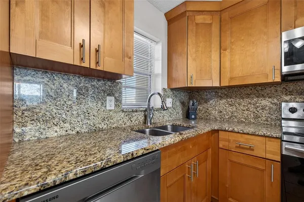 a kitchen with sink cabinets and a counter top space