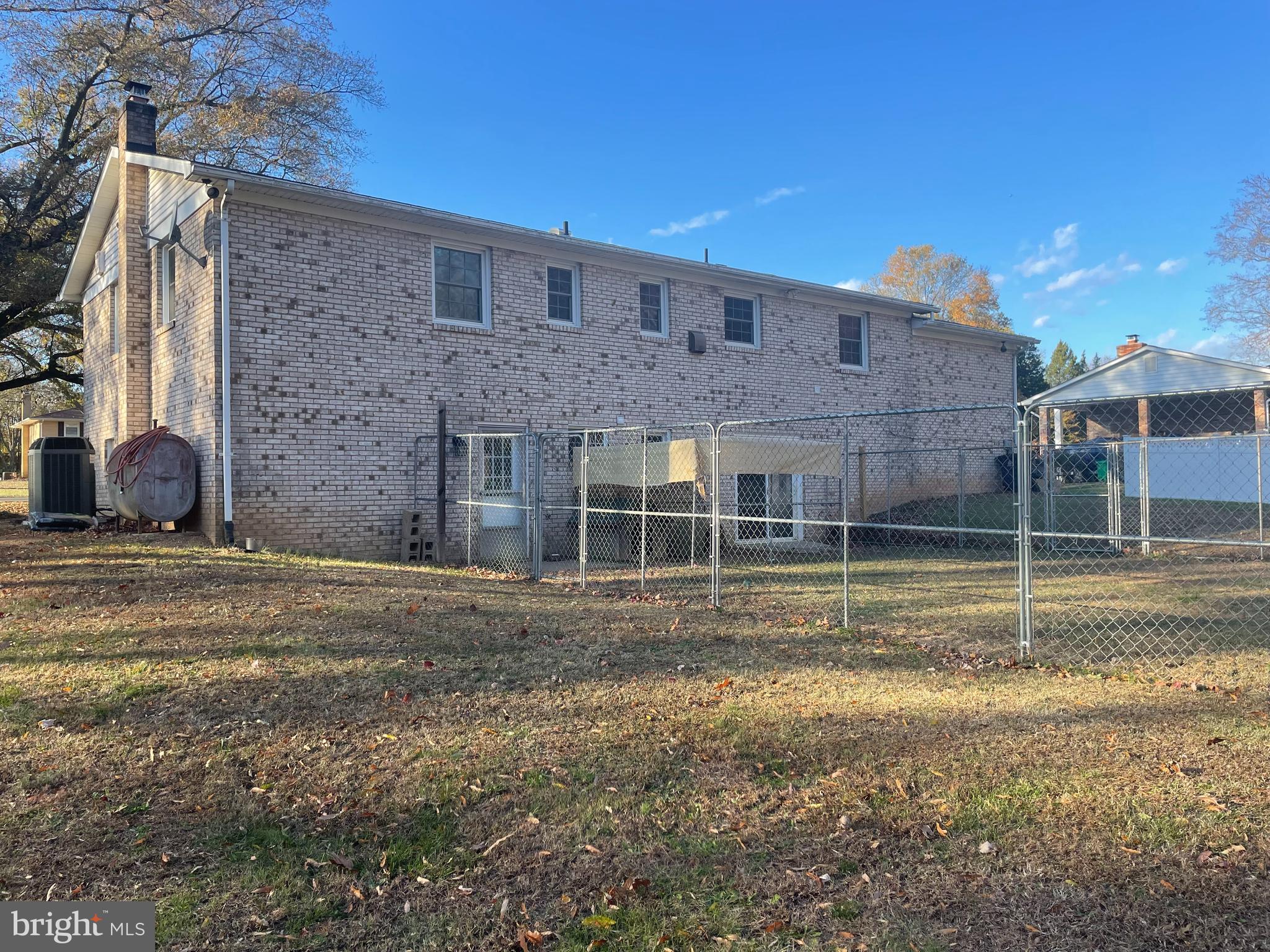 13710 South Springfield Road Brandywine, MD 20613 - Photo 10 of 64 a view of a brick house with a yard